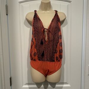 Free People Boho salmon pink and navy print tassel open size bodysuit NWT